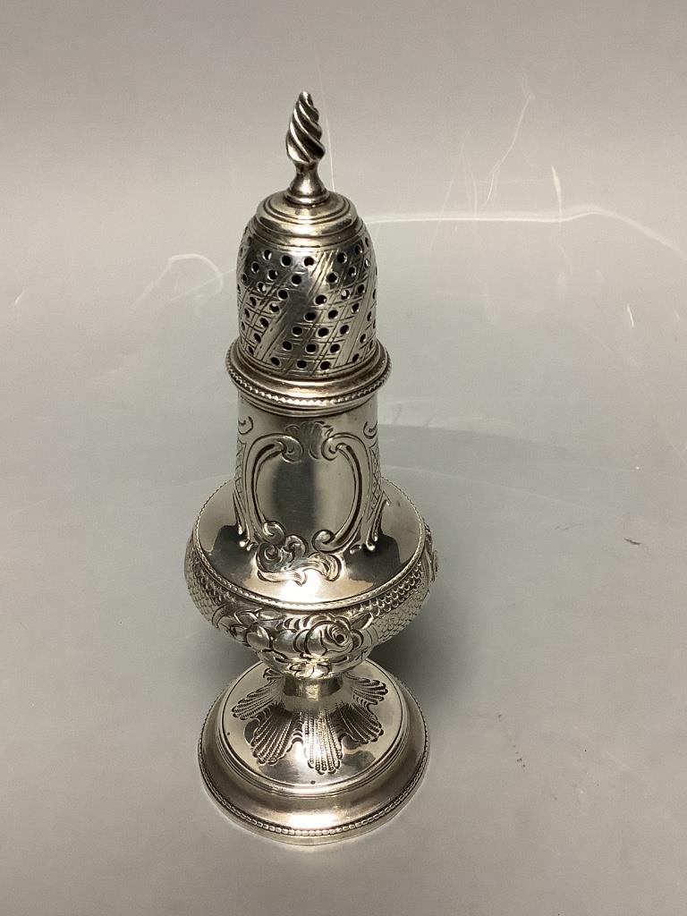 A George III silver baluster caster, with later embossed decoration, Thomas Shepherd, London, 1785, 15.5cm